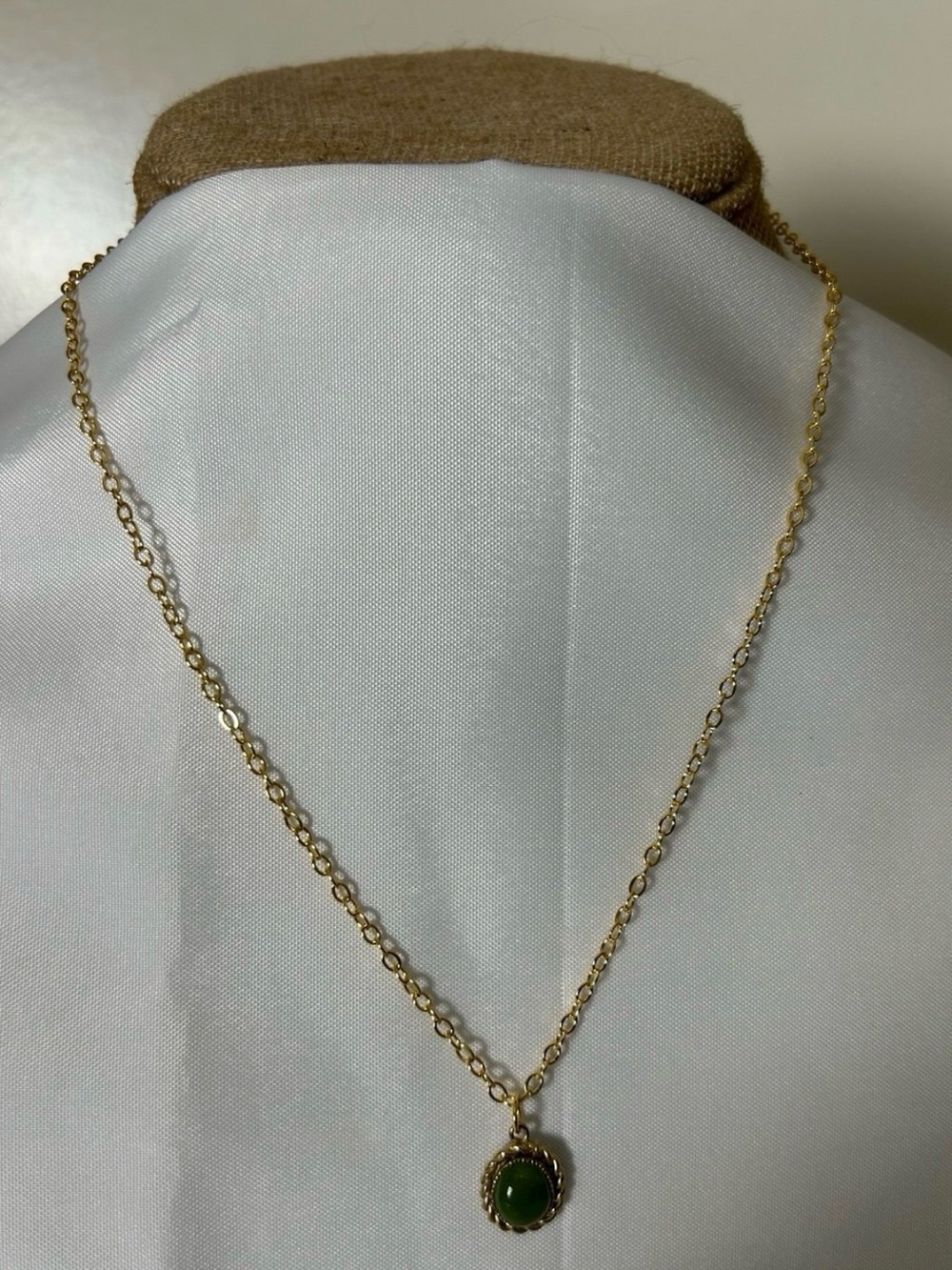 Lovely Gold Tone necklace with a Green Chalcedony Stone. Measures 18” w/ 2” ext